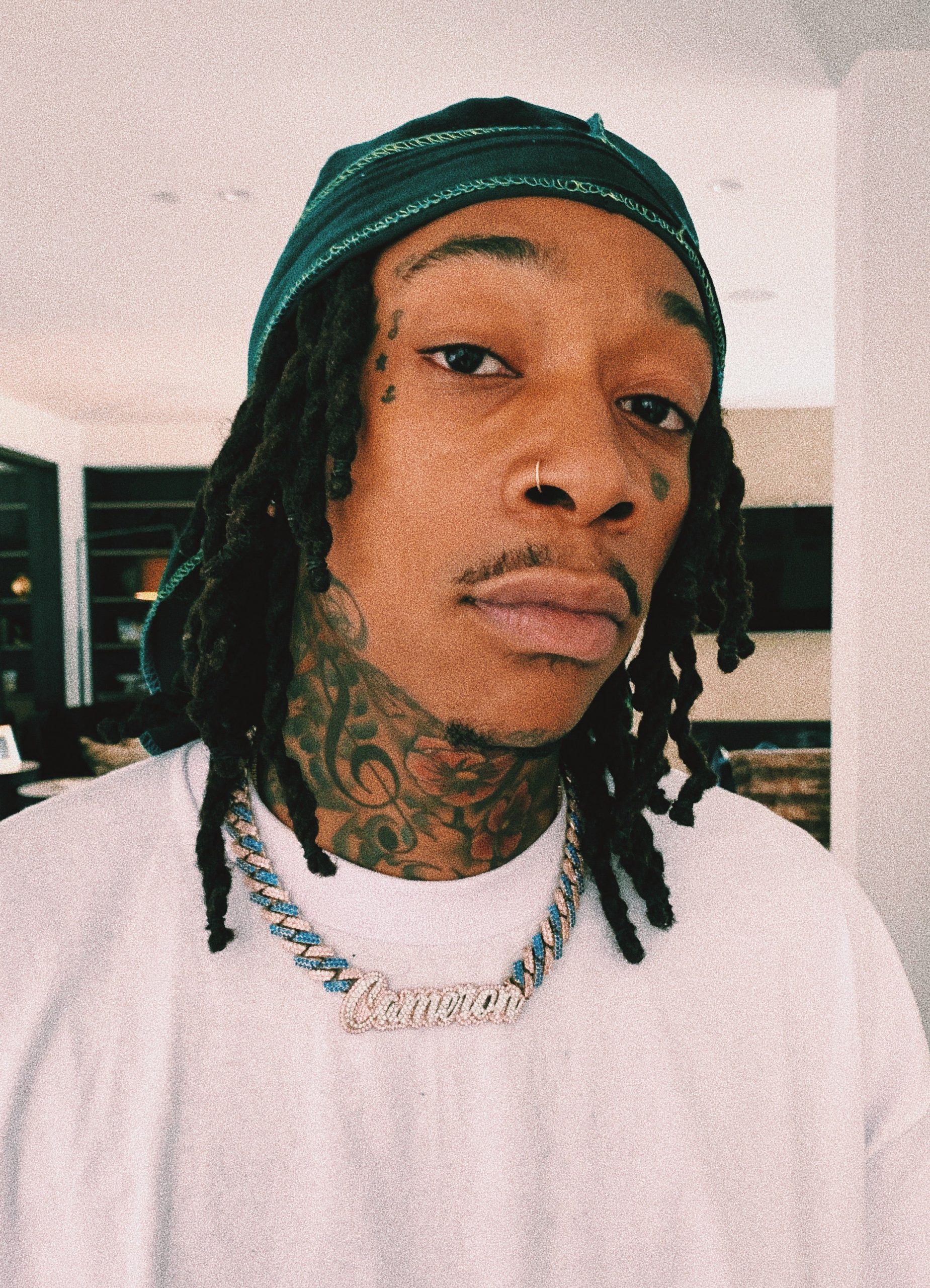 Wiz Khalifa wearing his GLD Shop chain that Christian Johnston designed for
him.