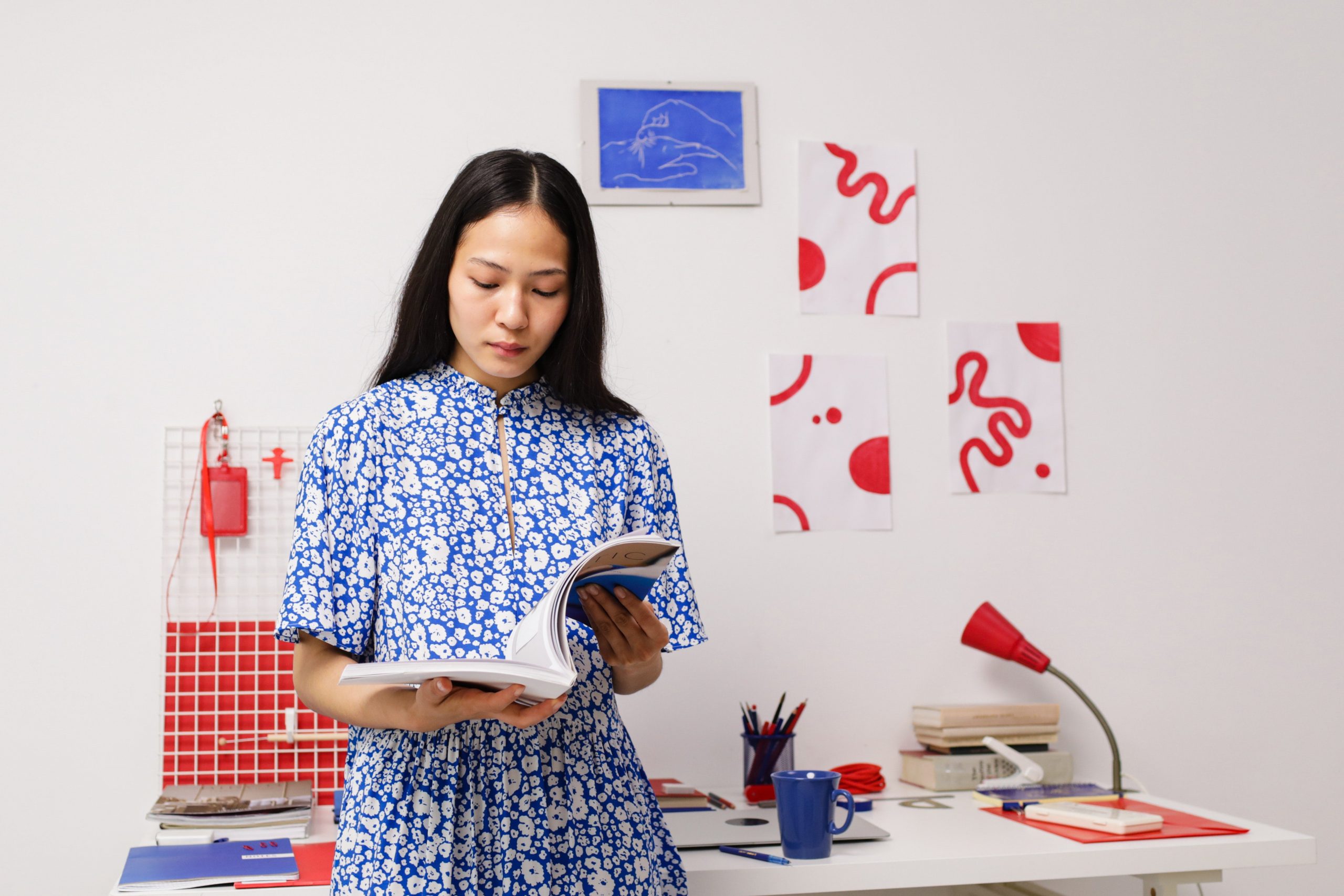 A woman reads a book inside a design
studio