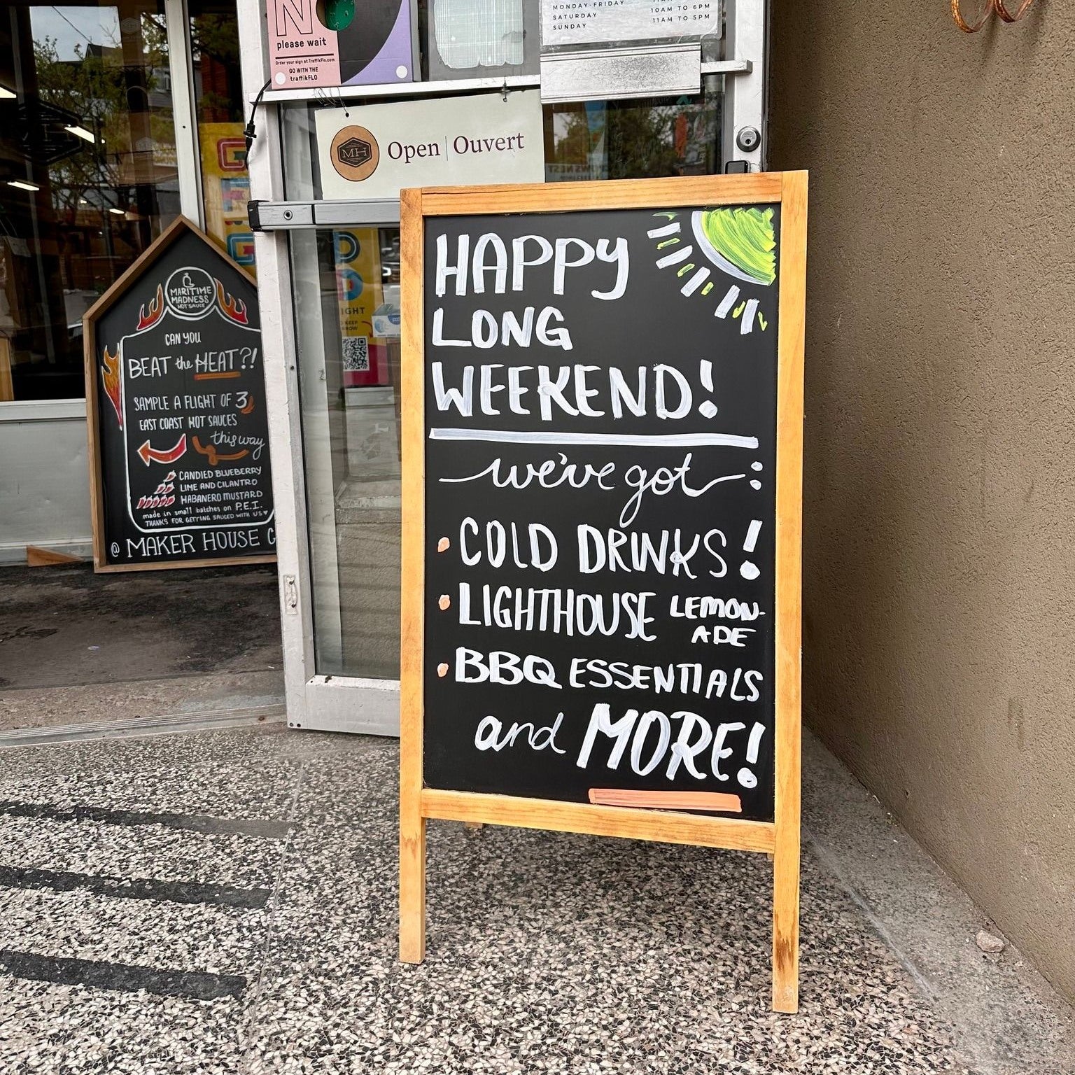 Maker House sandwich board sign outside the door of the
store