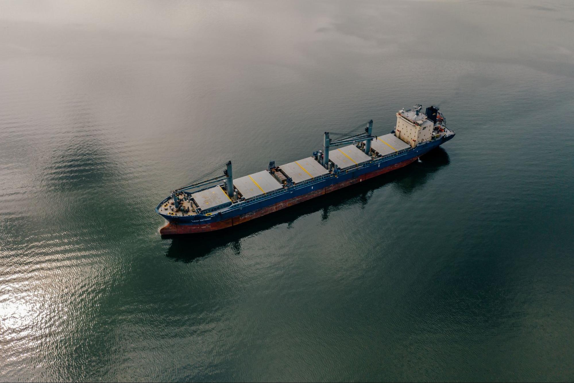 Shipping container moving through ocean waters on its way to
port.